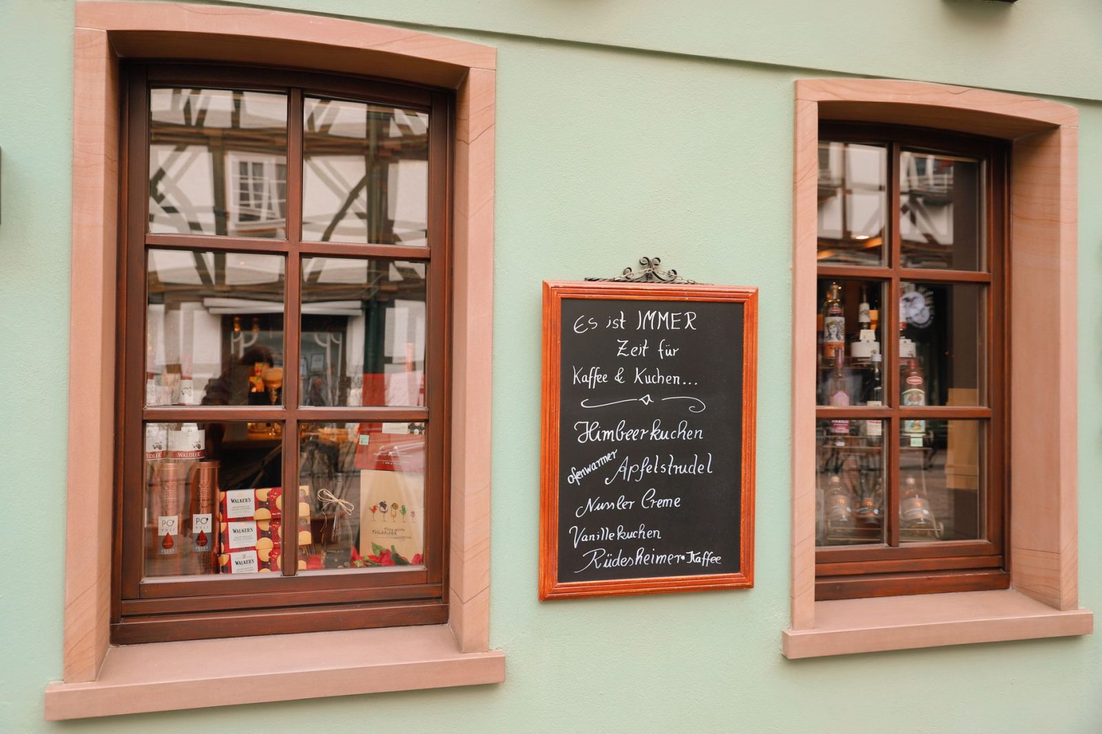 A café window in Eschwege, Germany, with a chalkboard menu
